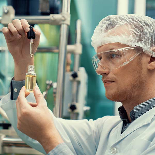 cbd extraction scientist wearing ppe while working